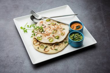 Uthappam oruttapam, Güney Hindistan 'da domates, soğan ve acı biber içeren bir tür dosyadır.