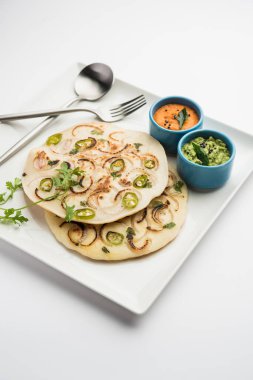Uthappam oruttapam, Güney Hindistan 'da domates, soğan ve acı biber içeren bir tür dosyadır.