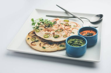 Uthappam oruttapam, Güney Hindistan 'da domates, soğan ve acı biber içeren bir tür dosyadır.