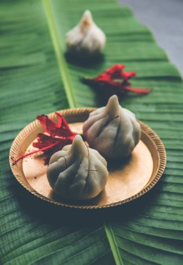 Ukdiche Modak are steamed dumplings with an outer rice flour dough and a coconut-jaggery stuffing, Indian food offered to lord ganesha on Chaturthi clipart