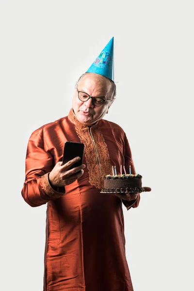 Indian Old Man Celebrating Own Birthday Blowing Candles Cake While — Stock Photo, Image