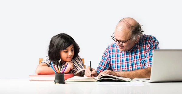 Indian Grandfather Teaching Granddaughter Books Pencil Laptop Home Schooling Tuition — Stock Photo, Image