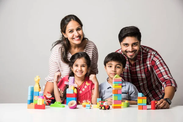 Indian Small Kids Playing Colourful Block Toys Young Parents White — Stock Photo, Image