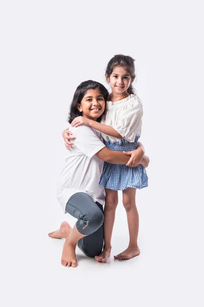 Cute Little Indian Asian Siblings Standing Embracing Each Other White — Stock Photo, Image