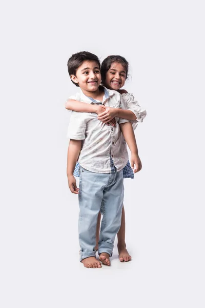 Cute Little Indian Asian Siblings Standing Embracing Each Other White — Stock Photo, Image