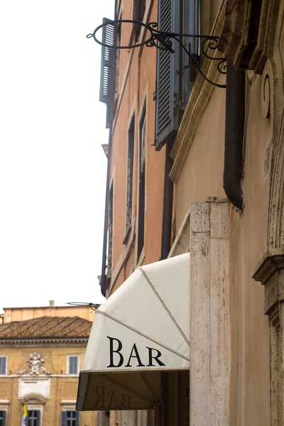 bar terrace sign on a building with classical architecture