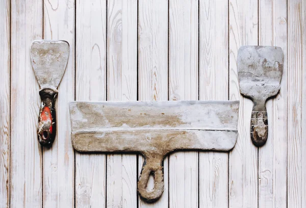 Kit of putty knives. Spatulas with the remaining mortar. Gastarb