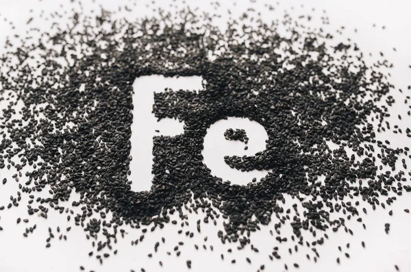 Chemical Element Word Ferrum Abbreviated Form Written Black Sesame Seeds — Stock Photo, Image