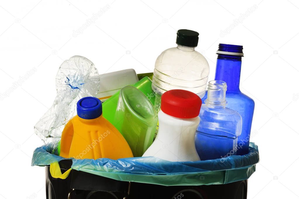 garbage bin full of bottles to recycle on white