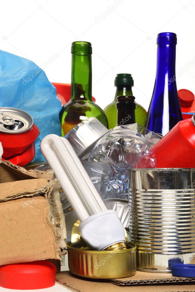 trash for recycling with paper glass bottles, cans, plastic bottle, light bulb