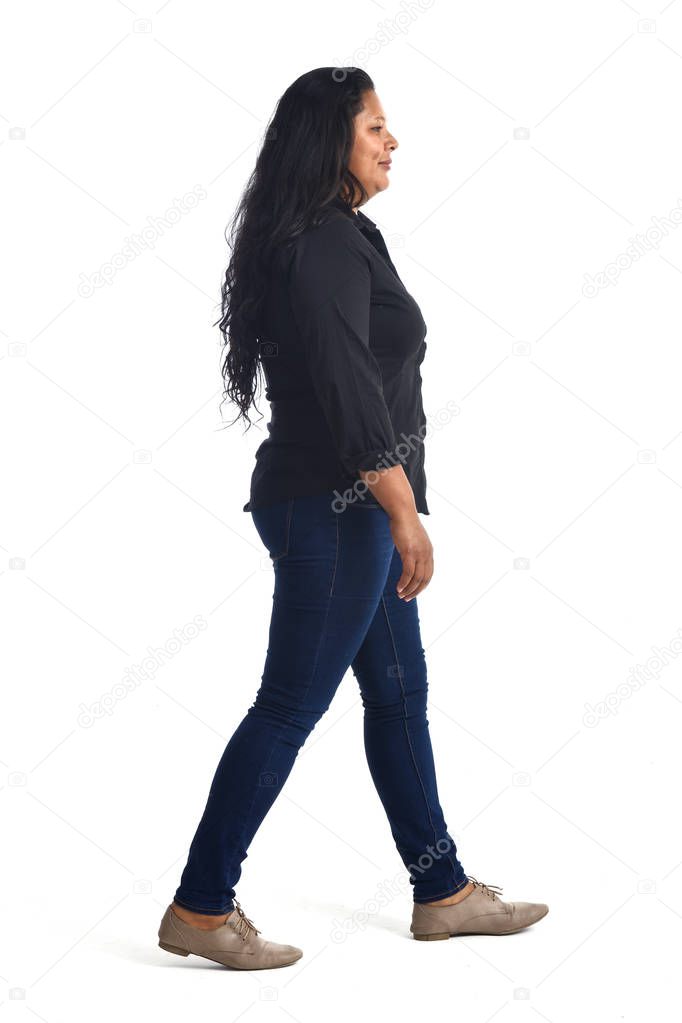 full portrait of a latin woman walking on white background