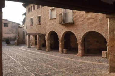 square of medieval village of Alquezar, Somontano, Huesca province, Aragon, Spain clipart