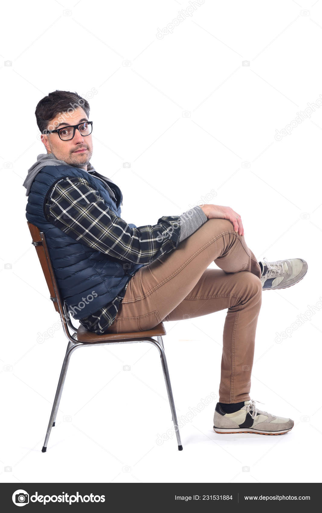 Portrait Man Sitting Chair Legs Arms Crossed Looking Camera Royalty Free Photo Stock Image By C Mariaic 231531884