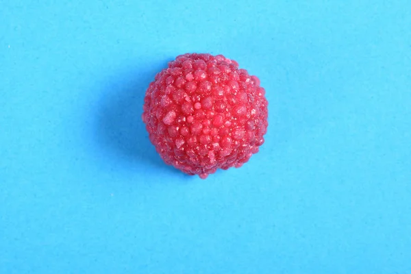 Blackberry  jelly candy on blue background — Stock Photo, Image