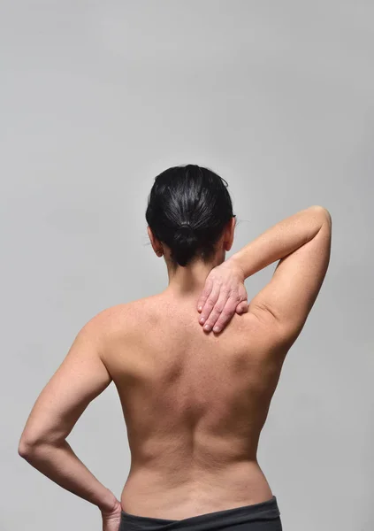 middle-aged woman with shoulder pain