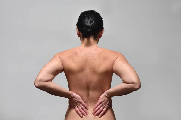 middle aget woman with low back pain