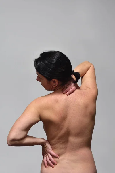 middle aget woman with pain back