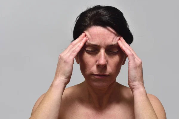 Middle-aged woman with headache — Stock Photo, Image