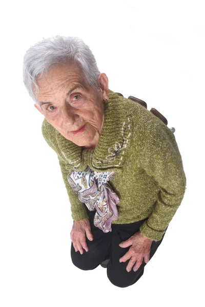 Κάτοψη του μια ηλικιωμένη γυναίκα που κάθεται σε μια καρέκλα — Φωτογραφία Αρχείου