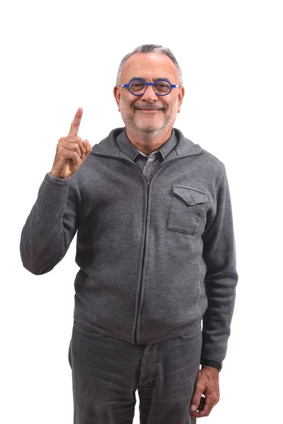 Senior man with finger in the shape of number — Stock Photo, Image