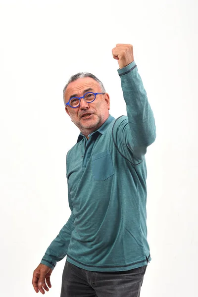 Man raising her arms and smiling in victory sign on white backgr — Stock Photo, Image