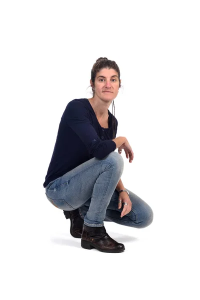 Full portrait of woman sitting in the floor on white — Stock Photo, Image