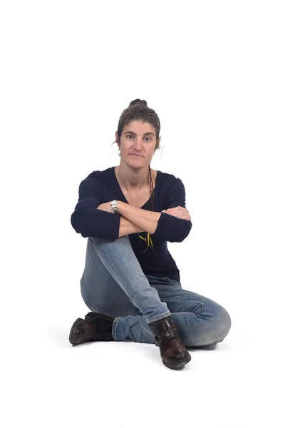 Full portrait of woman sitting in the floor on white — Stock Photo, Image