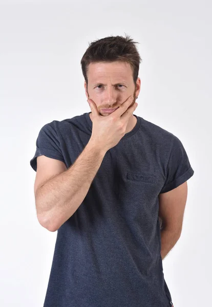 Annoyed and pensive man on white background — Stock Photo, Image