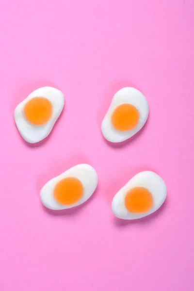group of egg fried on pink background