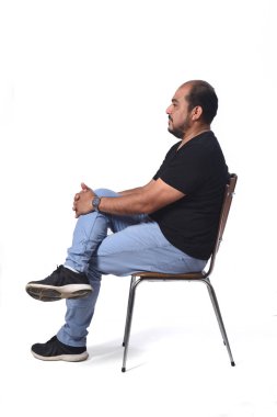 full portrait of a south american  man sitting on a chair on whi clipart