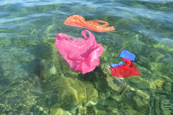 Plastic bags floating in the sea — Stock Photo, Image