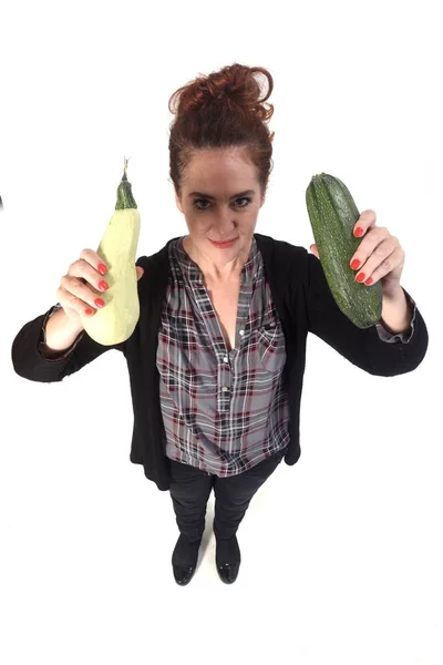 Portrait of a woman with zucchini on white background — Stock Photo, Image