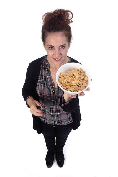 woman with a bowl of cornflakes on white background