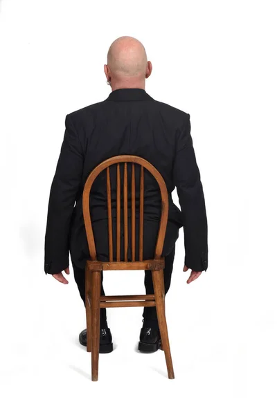 Man Sitting Chair Her Back White Background — Stock Photo, Image