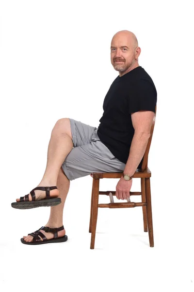 Bald Man Sandals Shirt Shorts Sitting White Background Looking Camera — Stock Photo, Image