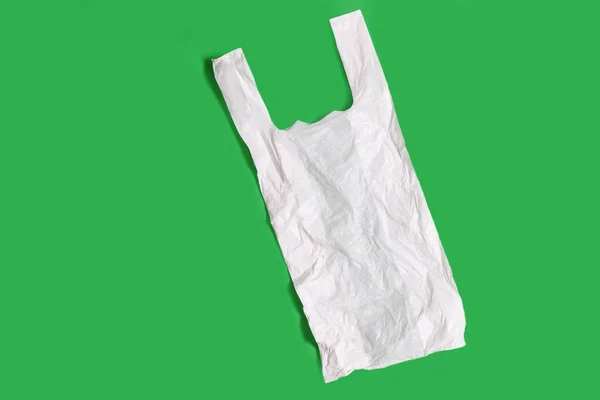 White Plastic Bag Green Background — Stock Photo, Image