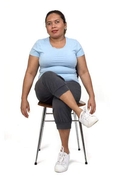 Front View Latin Woman Sitting Chair Looking Camera White Background — Stock Photo, Image