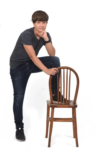 Adolescent Garçon Jouer Avec Une Chaise Fond Blanc Main Sur — Photo