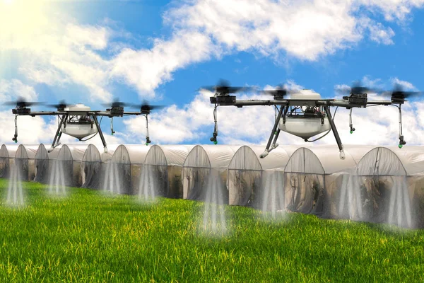 Agriculture drone flying over Hydroponic organic fresh vegetable garden farm at greenhouse against blue sky with rice fields.