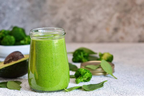 Green smoothie with spinach, avocado and broccoli 