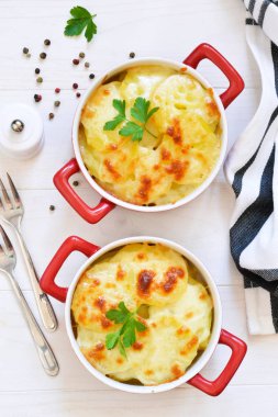 Potato casserole with bechemel sauce and cheese  clipart