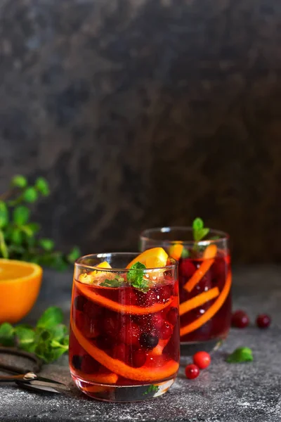 Cold cranberry juice with orange and mint. Summer drink. — Stock Photo, Image
