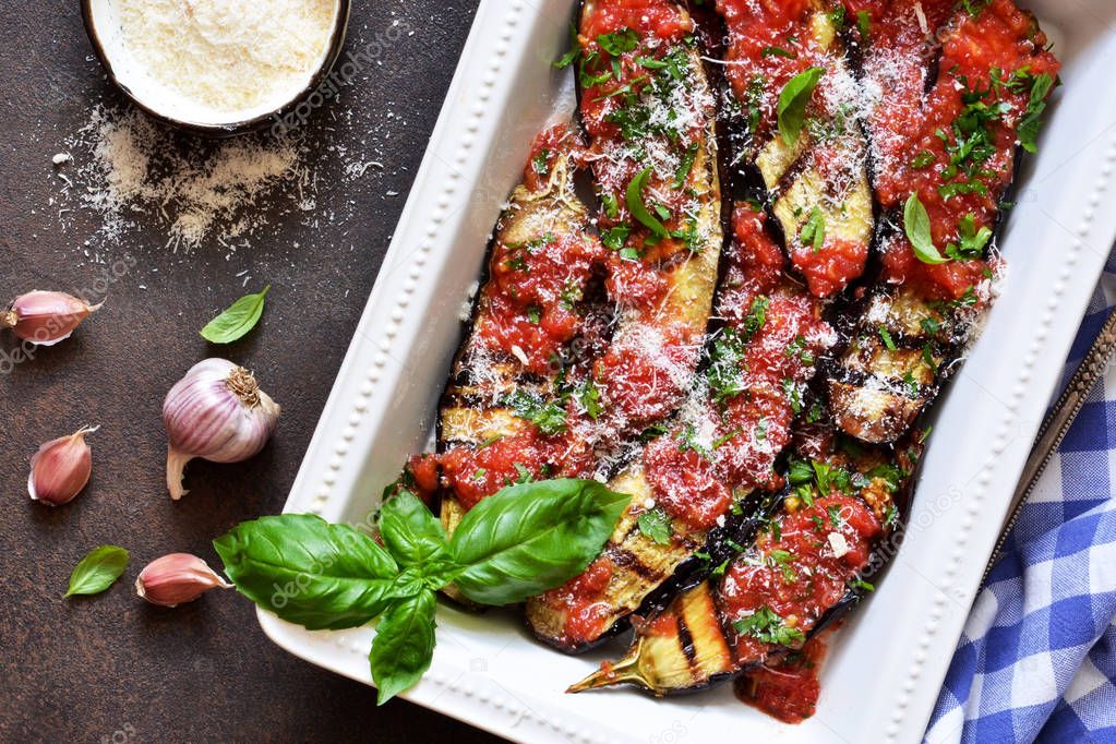 Baked eggplants with toasted sauce, basil and parmesan. Moussaka