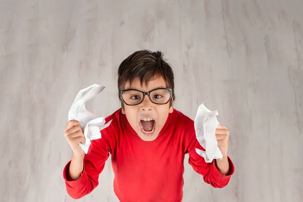 Boy Red Shirt Glasses Screams Holds His Hands Crumpled Paper — Stock Photo, Image