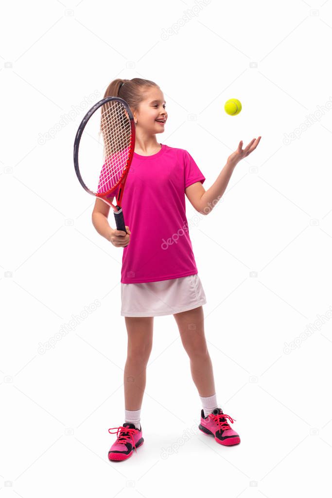 Studio shot of a little smiling girl dressed in pink T-shirt and