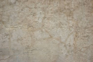 Alçı üzerinde bir çatlak ile eski kaba gri duvar. Yapılandırılmış Grunge 
