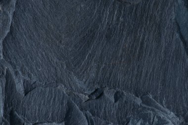 Dokulu siyah taş yüzeyinin arkaplanı