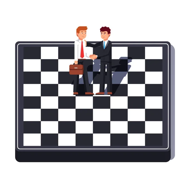 Uomini d'affari che stringono la mano in piedi sulla scacchiera — Vettoriale Stock