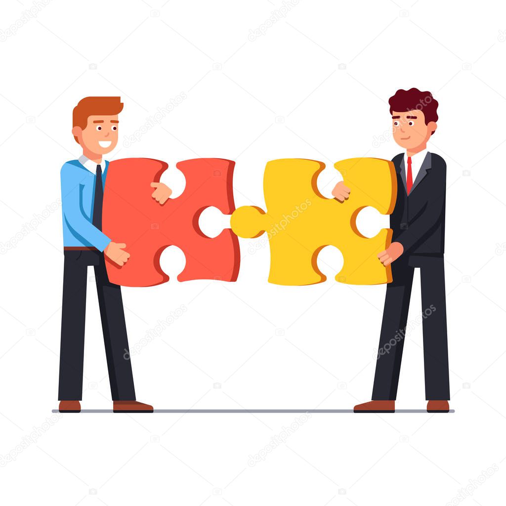 Business men joining together large puzzle pieces