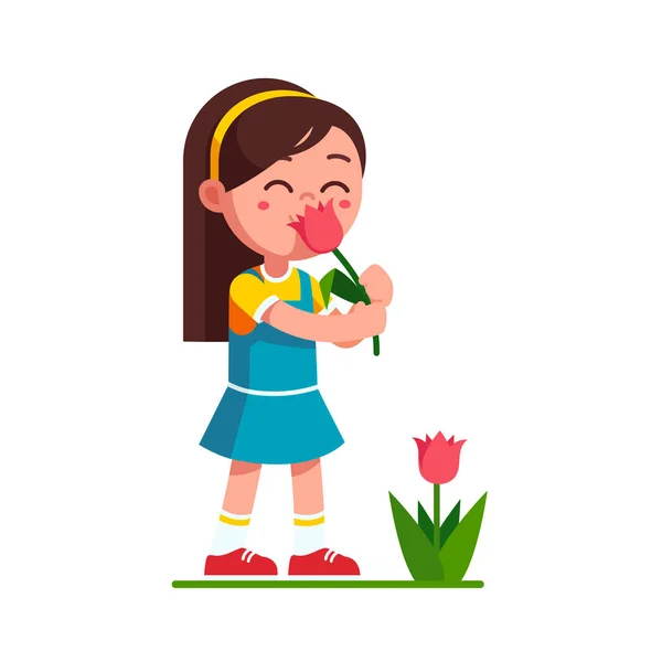 Niña sosteniendo tulipán flor y olerlo — Vector de stock